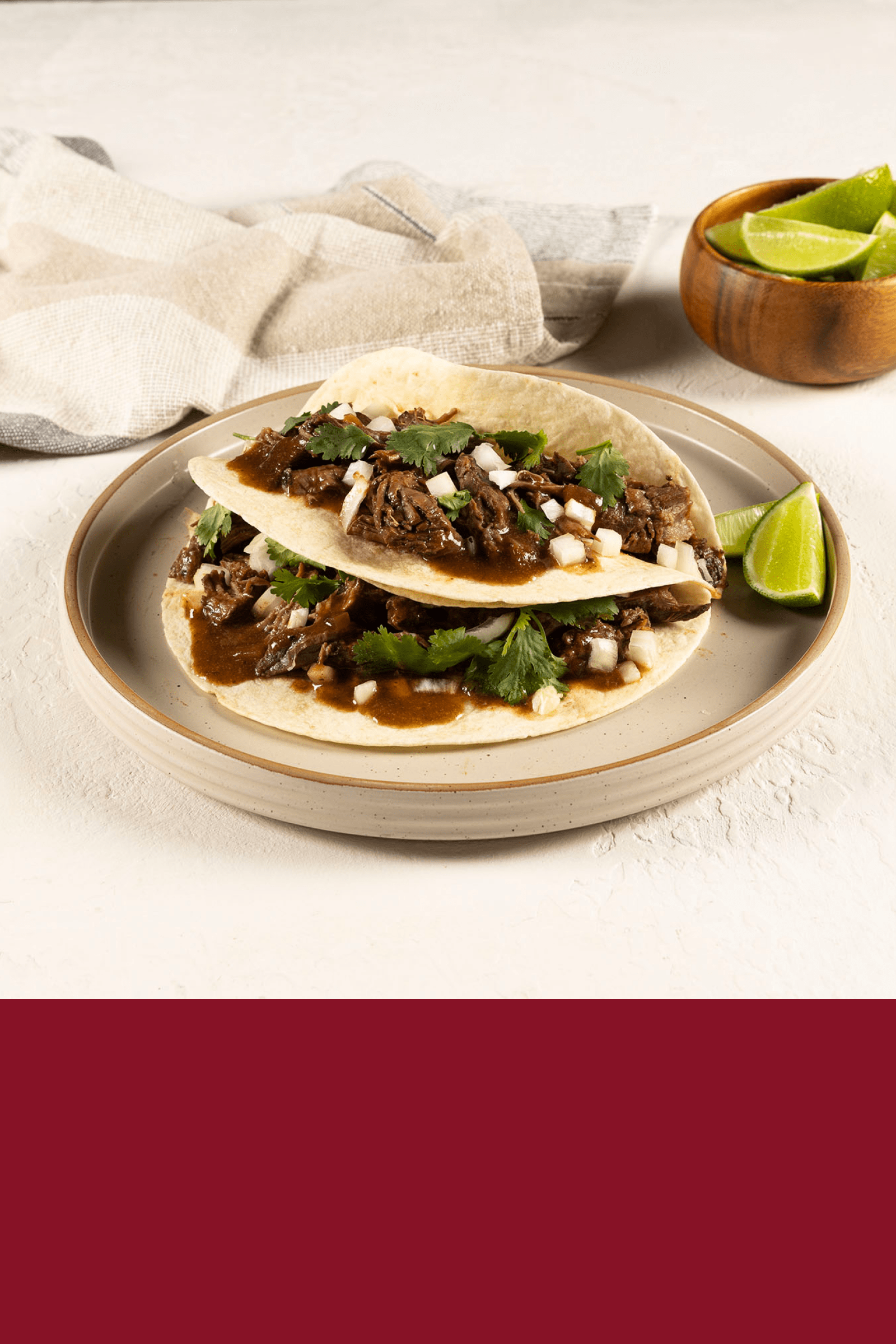 A plate with two Beef Barbacoa Tacos prepared with HEINZ HomeStyle Beef Gravy.