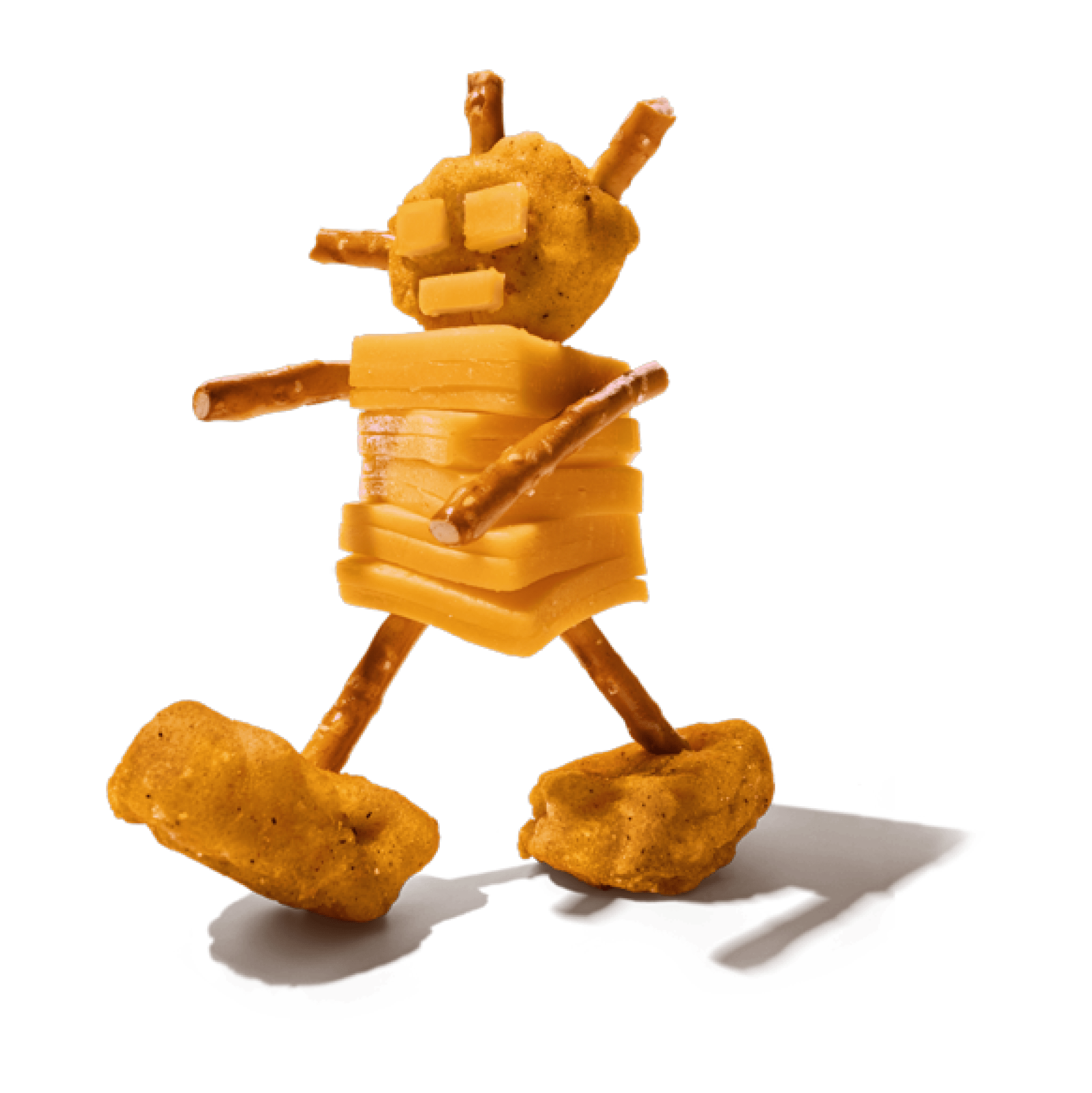 Figure made of stacked cheese slices, pretzel sticks, and chicken nuggets.