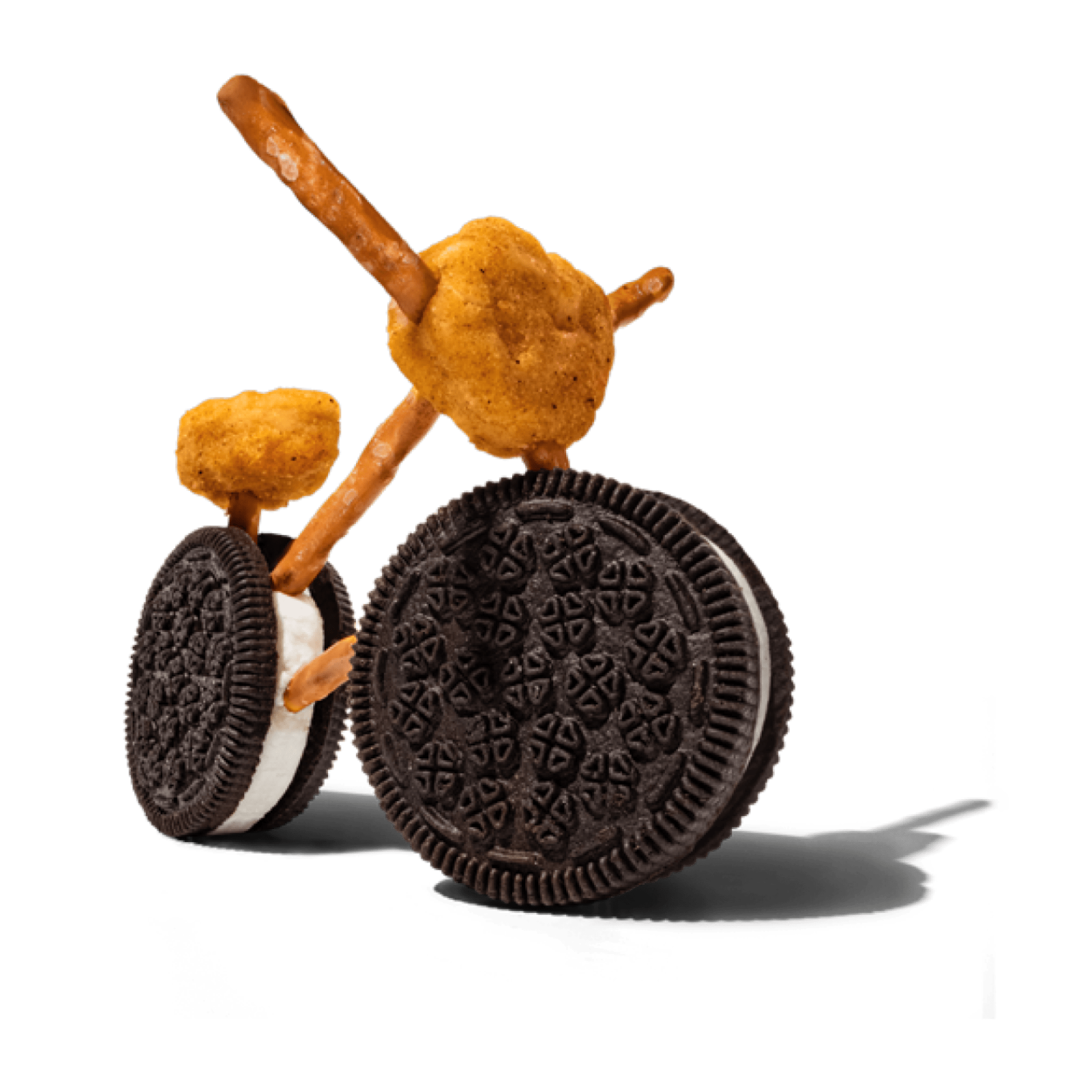A bicycle made of Oreo cookies, chicken nuggets, and pretzel sticks.