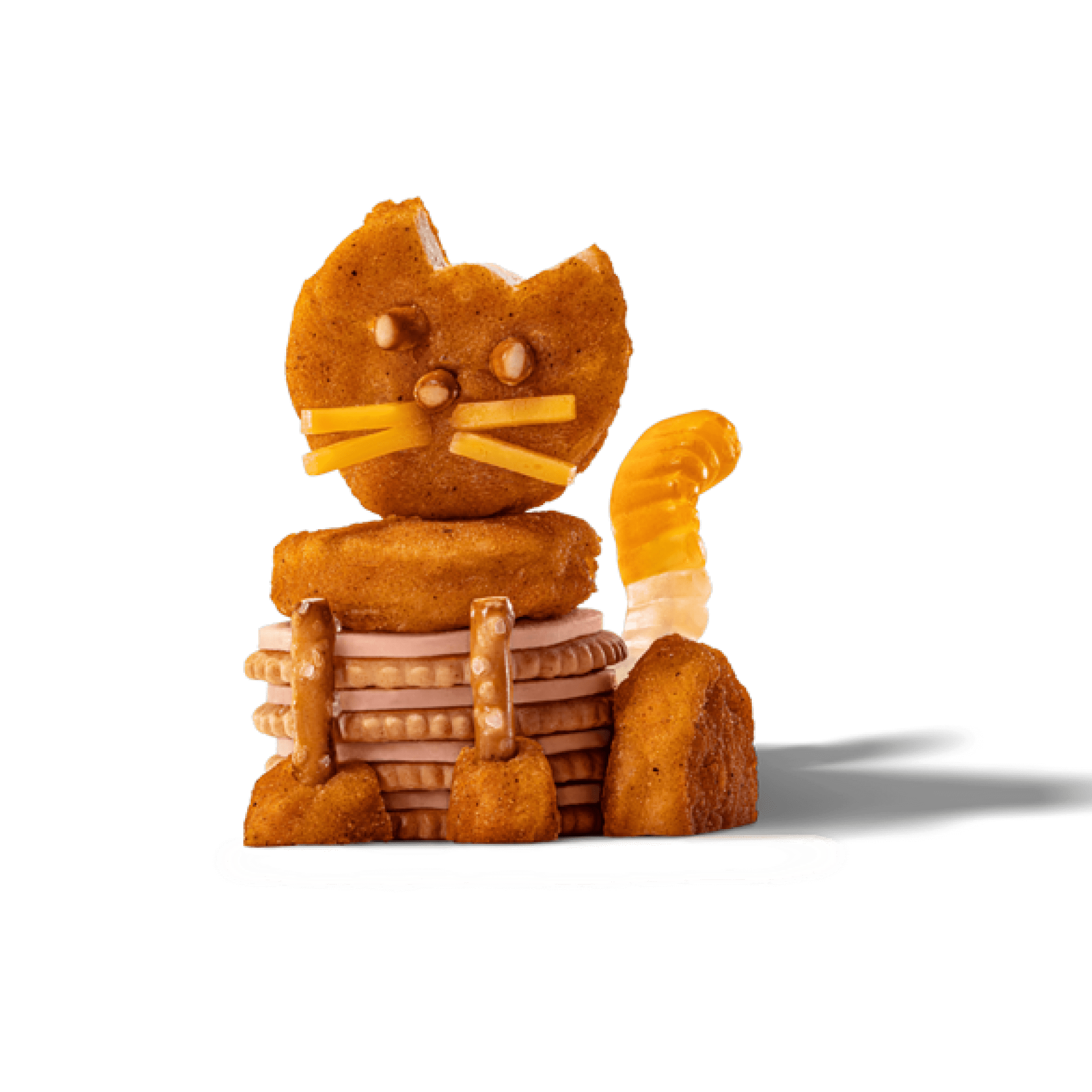 A cat sculpture made of chicken nuggets, crackers, pretzels, and cheese.