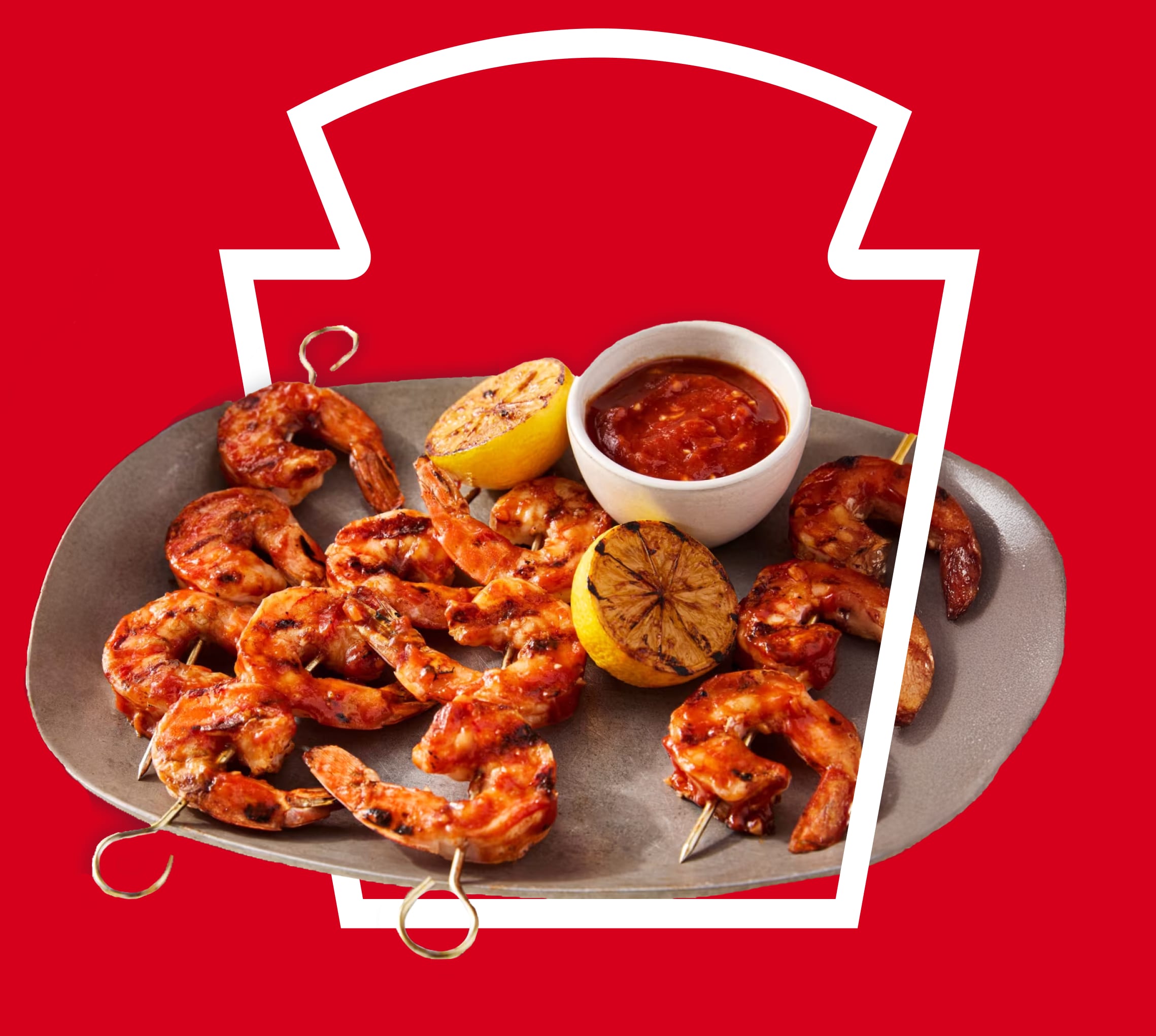 Grilled shrimp skewers and dipping sauce inside a white Heinz keystone outline on a red background.