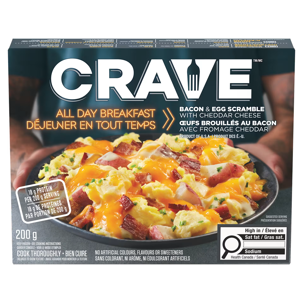 CRAVE Bacon & Egg Scramble frozen meal box with high protein, sodium, and sat fat labels.