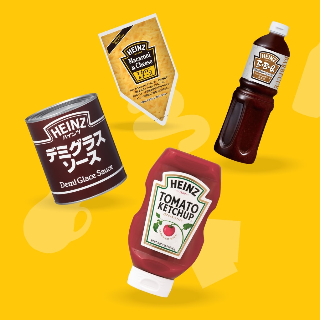 黄色い背景に、斜めに配置されたハインツのデミグラスソース缶、マカロニ＆チーズ、BBQソース、トマトケチャップ。