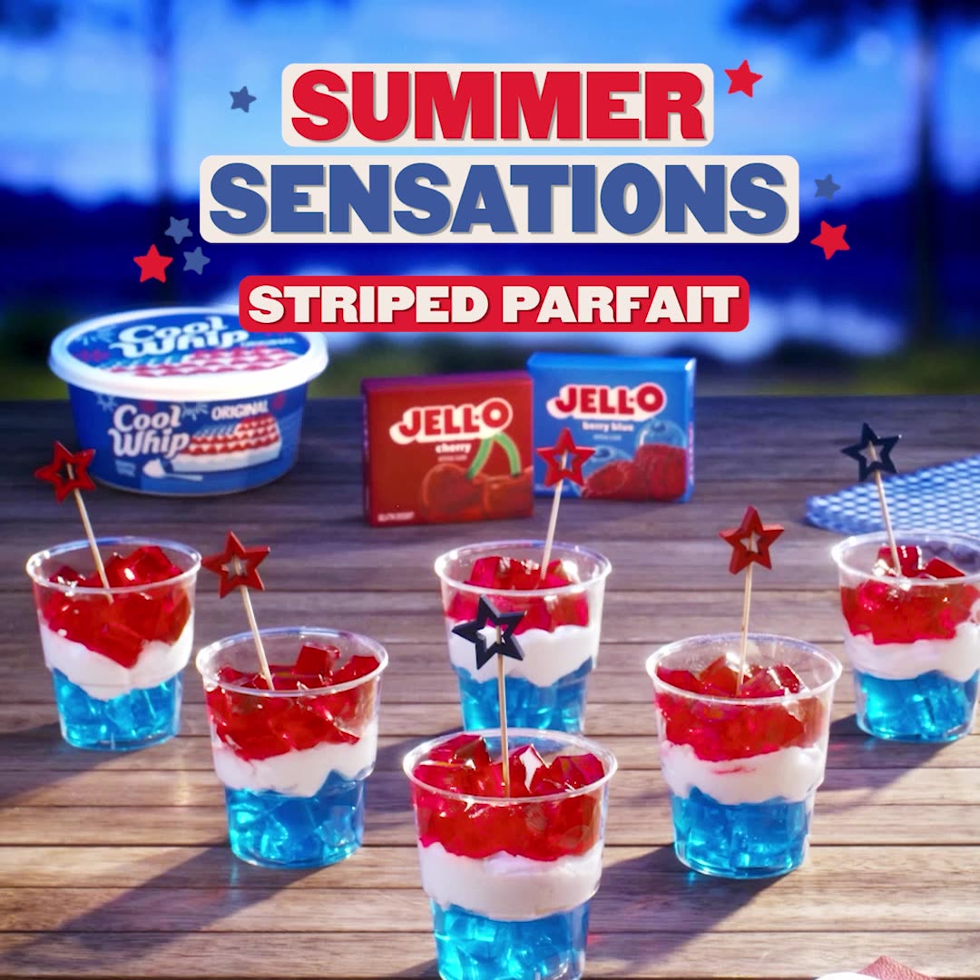 Six Star-Spangled Layered Parfait made with blue and red Jell-O and Cool Whip, on a picnic table. Text: Summer Sensations.