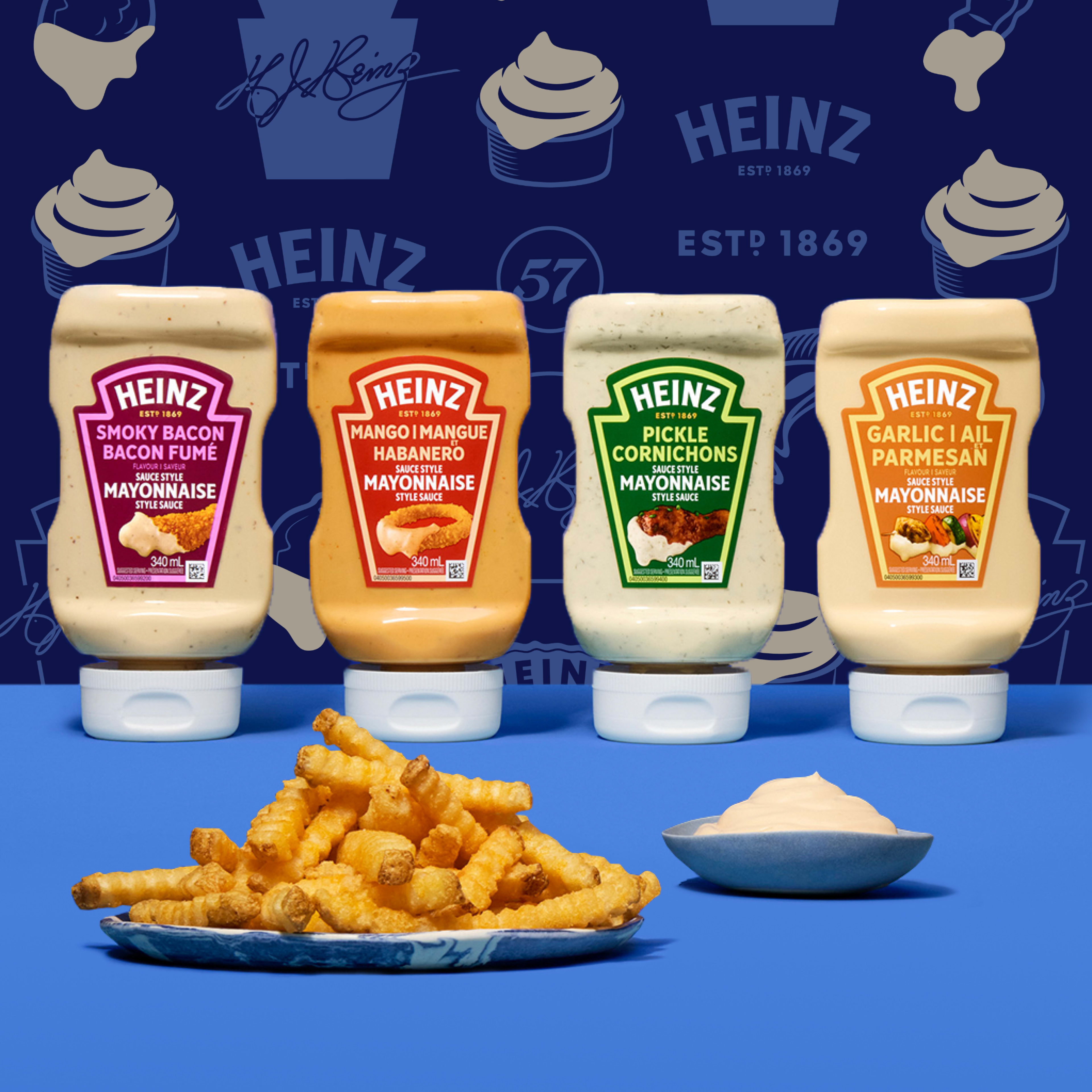 Four Heinz Mayonnaise Style Sauce bottles, including Smoky Bacon, Mango Habanero, Pickle Cornichons, and Garlic Parmesan.