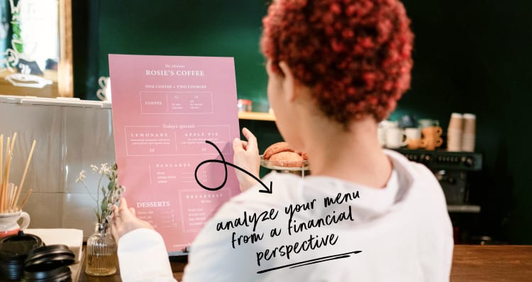 Woman in white shirt looking at a food menu