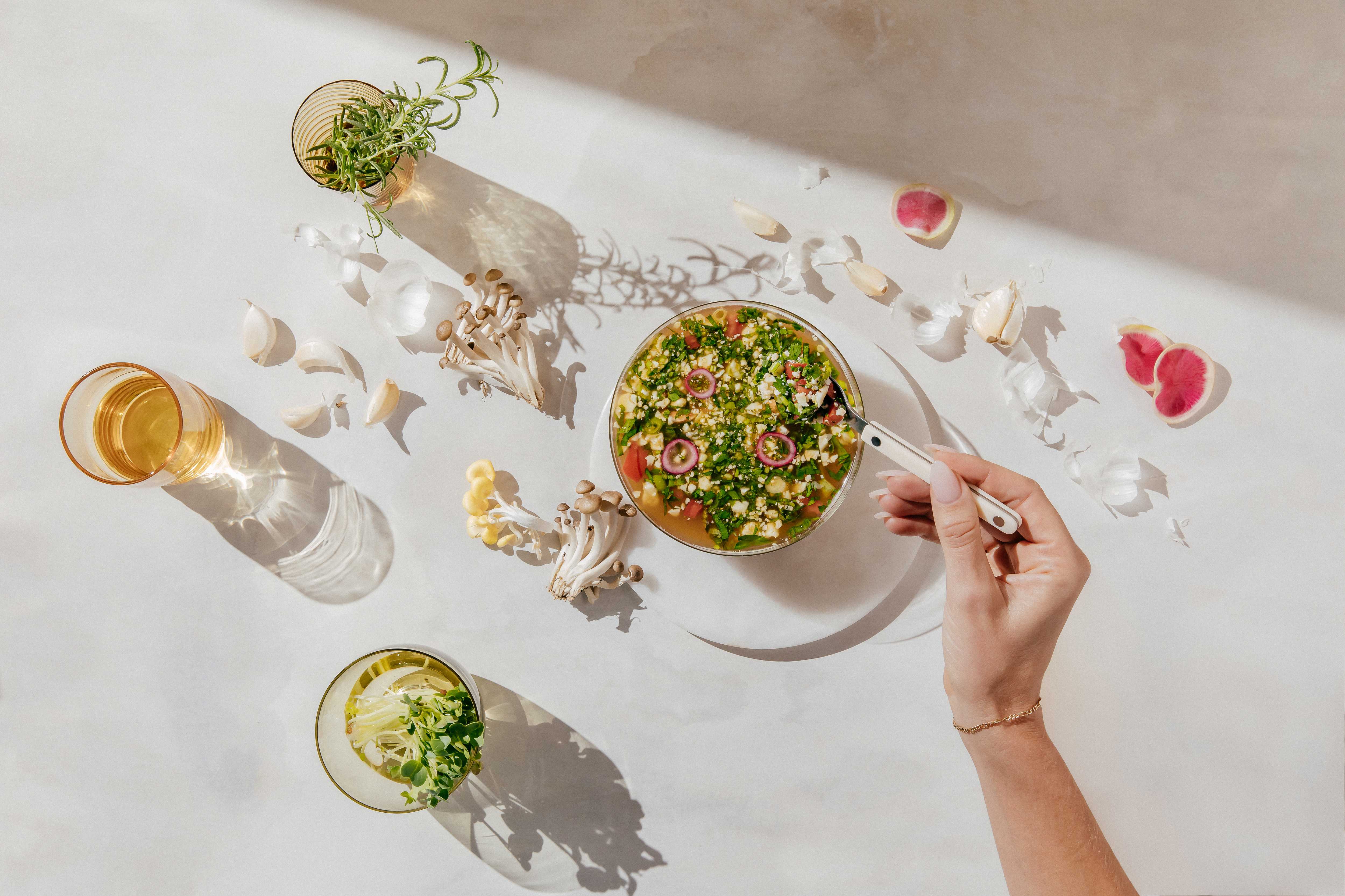 A bowl of prepared Kroma 24K Chicken Bone Broth with veggies.