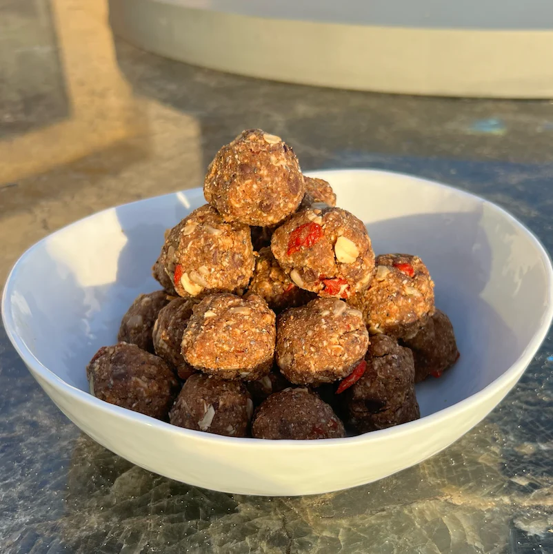 A stack of Kroma Super Porridge Protein Balls in a bowl.