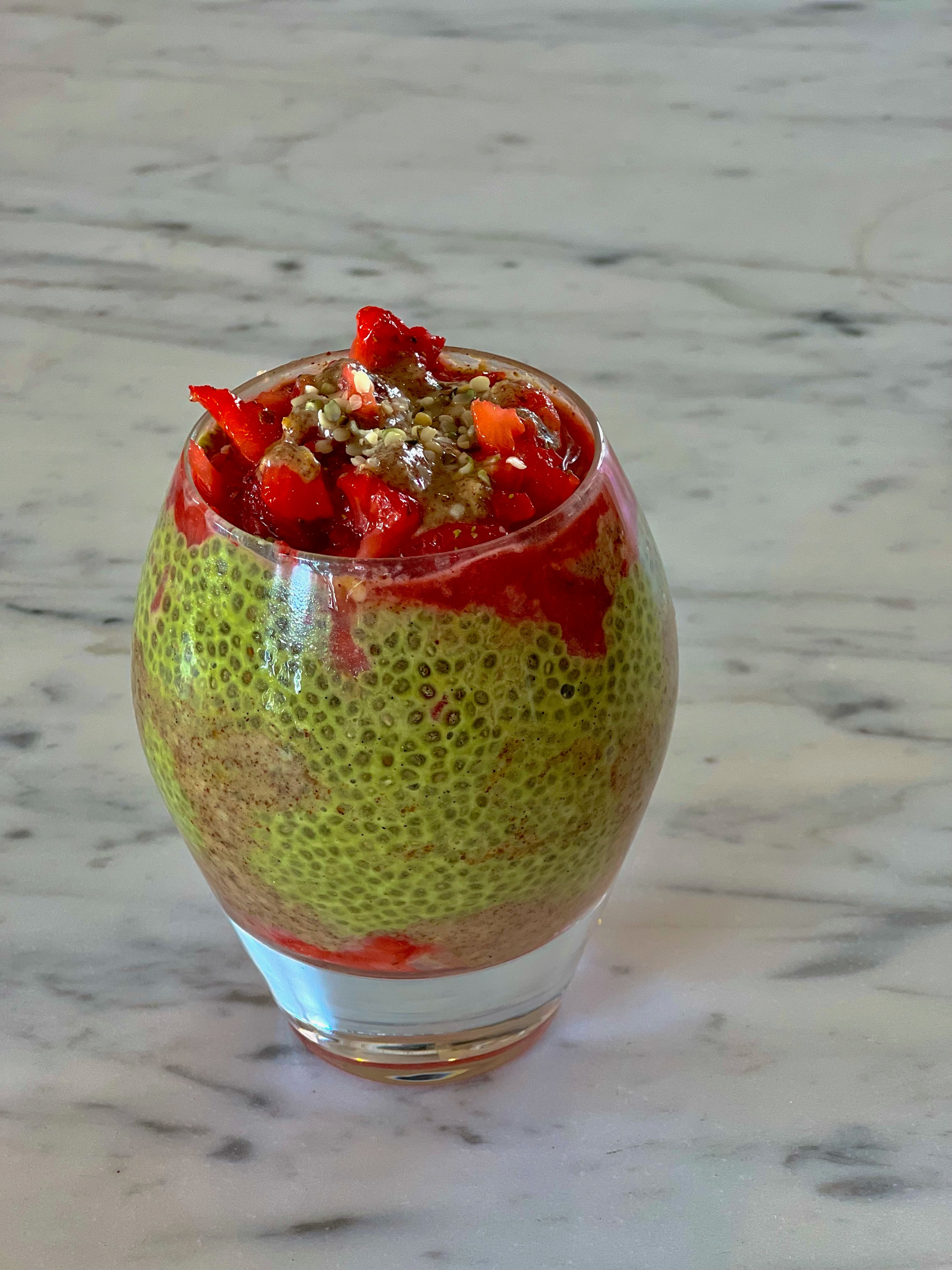 A glass of Kroma Beauty Matcha Chia Pudding.