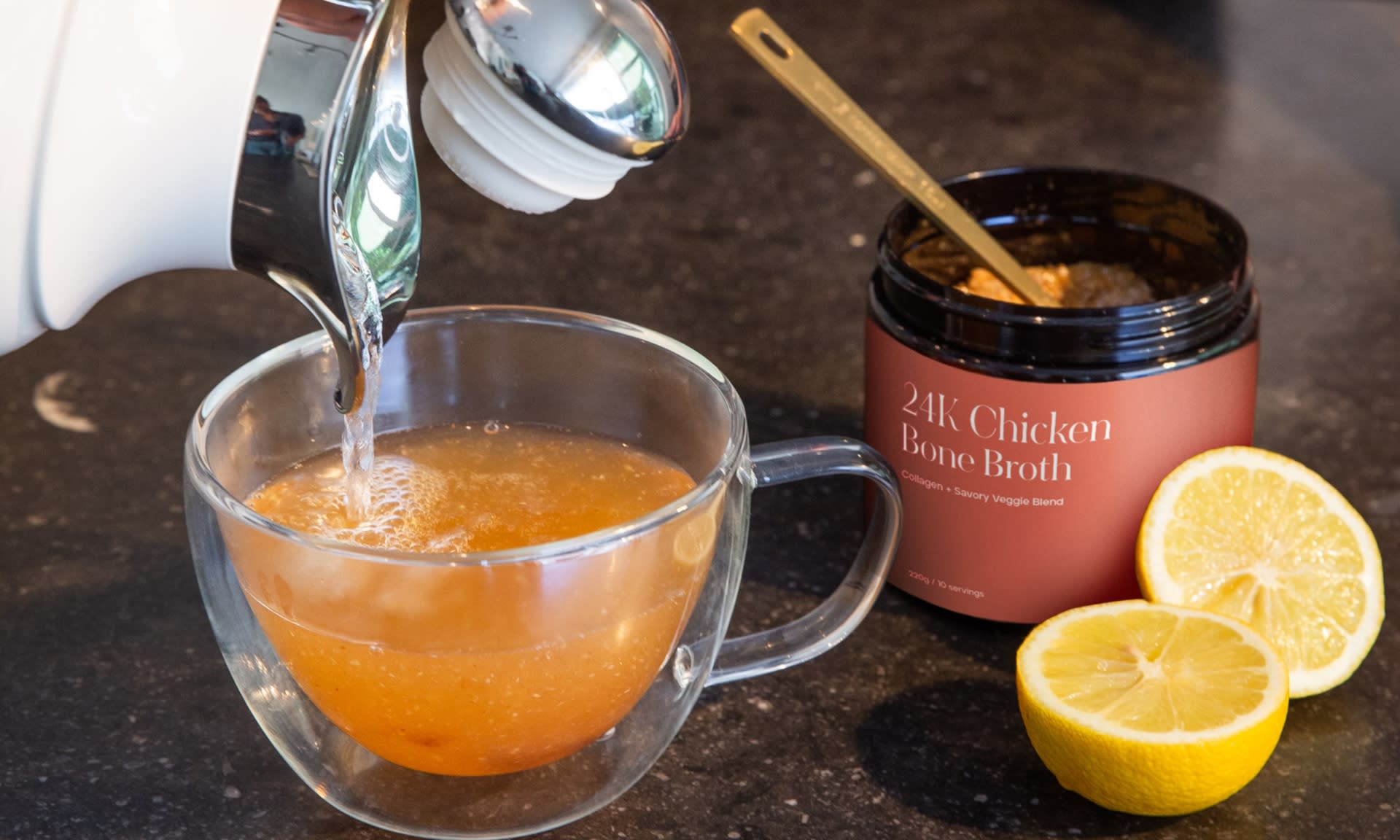 A delicious cup of bone broth along with its jar.