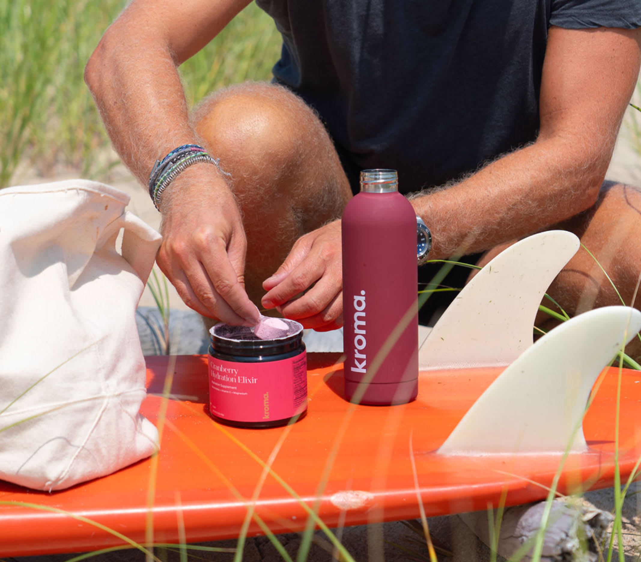 The man in the pic is scooping out Cranberry Hydration Elixir, from its jar to mix it with water, which makes is a powerful hydration booster for summer.