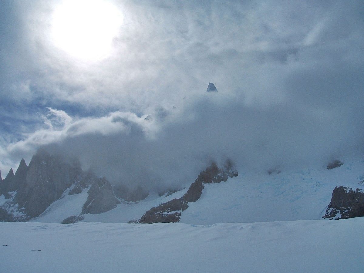 Cerro Torre peaking out of the cloud after a blizzard