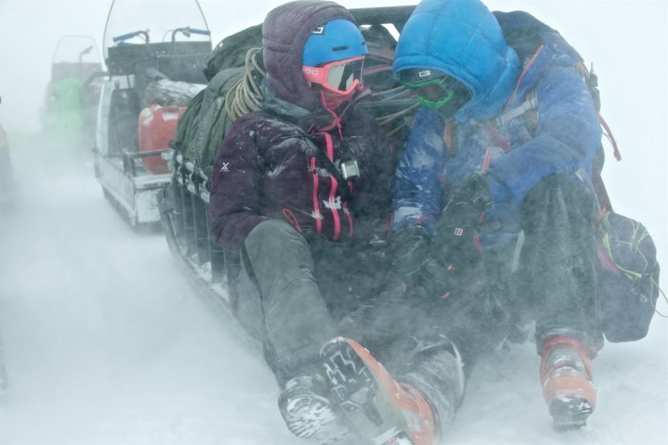 ulia, Warwick and Richard (yes Richard is there in the green) take shelter waiting for our snowmobile that struggled on the hills. Photo courtesy of Martin Hartley