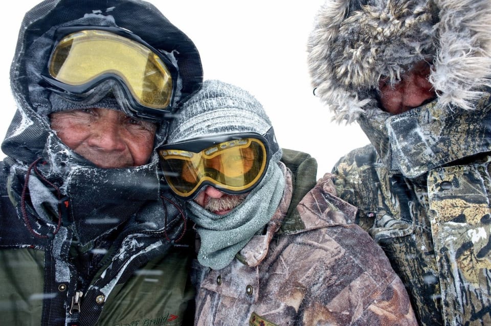 Picture of the three snowmobile drivers after dropping us off and heading back down to town. Photo courtesy of Martin Hartley