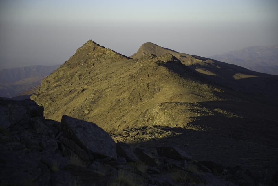 First rays of the sun on Tajos Altos and Cerro de Caballo
