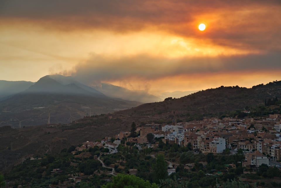 the smoke from the smouldering fires drifting north tonight bringing atmospheric conditions