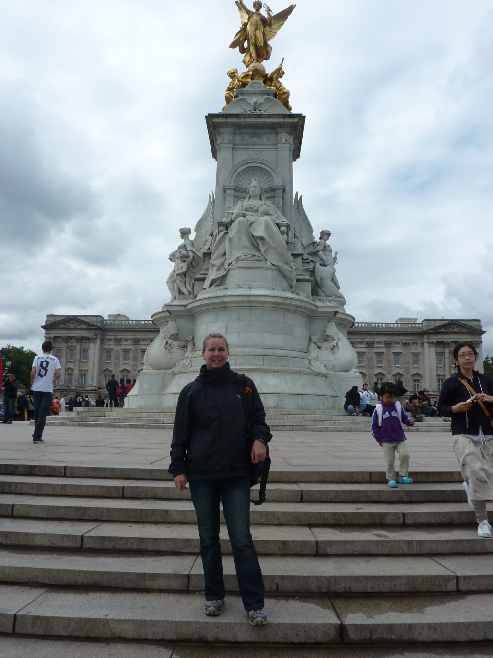 Me with Queen Victoria and Buckingham Palace behind