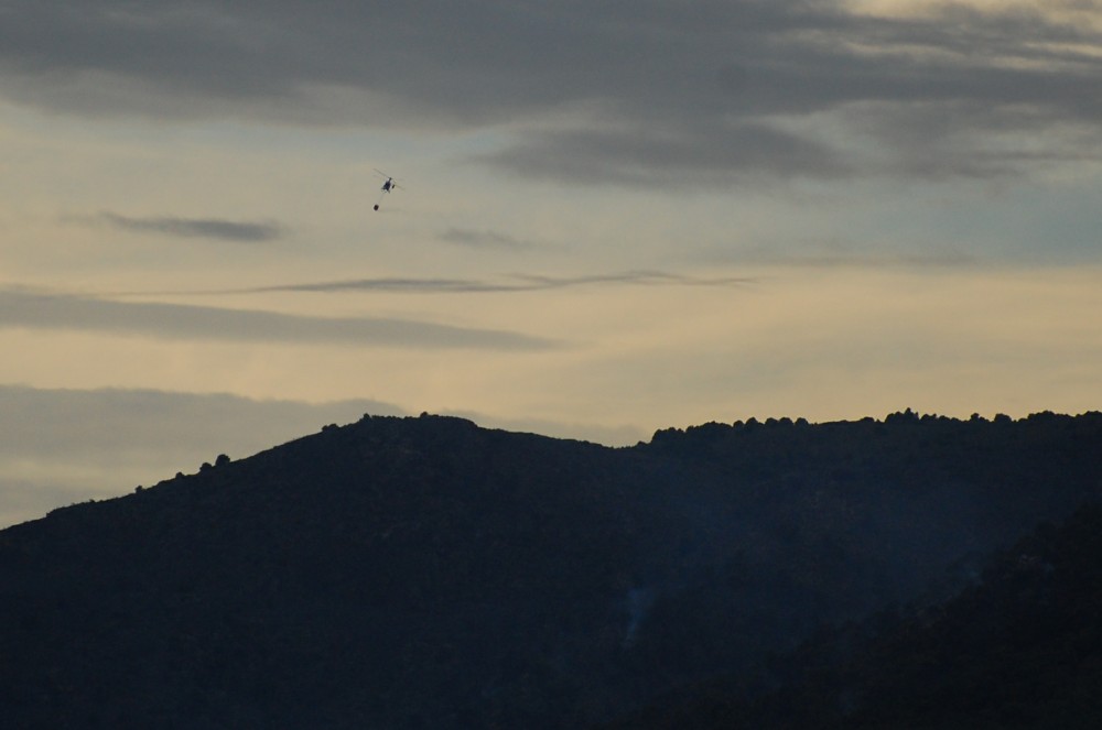 A helicopter silhouette as dusk sets in