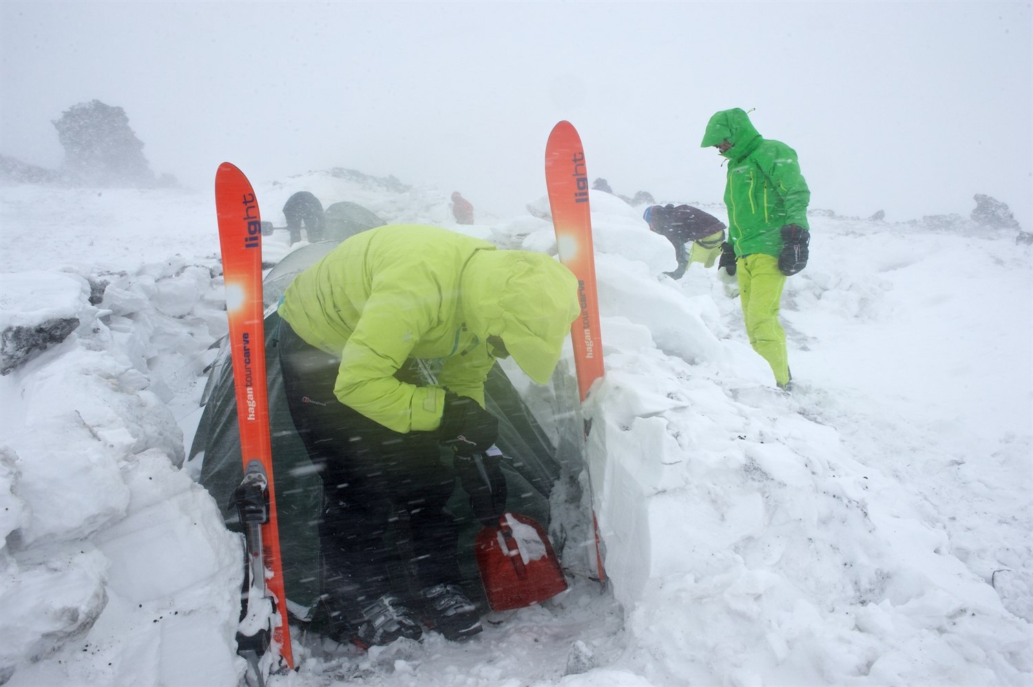Clearing out the porch area. You can see how the wind has sculpted the snow blocks and see the volcanic rocks embedded in the snow. Photo courtesy of Martin Hartley