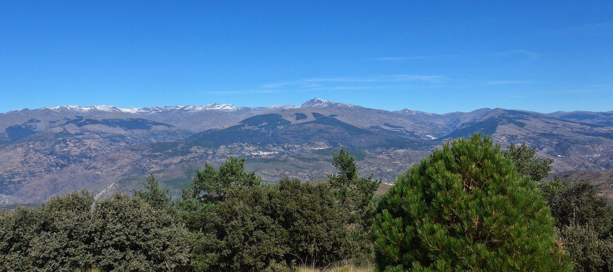 The view from the fire look out. The Sierra Nevada mountains with the left over of the recent snows and some of the villages in the Alpujarra