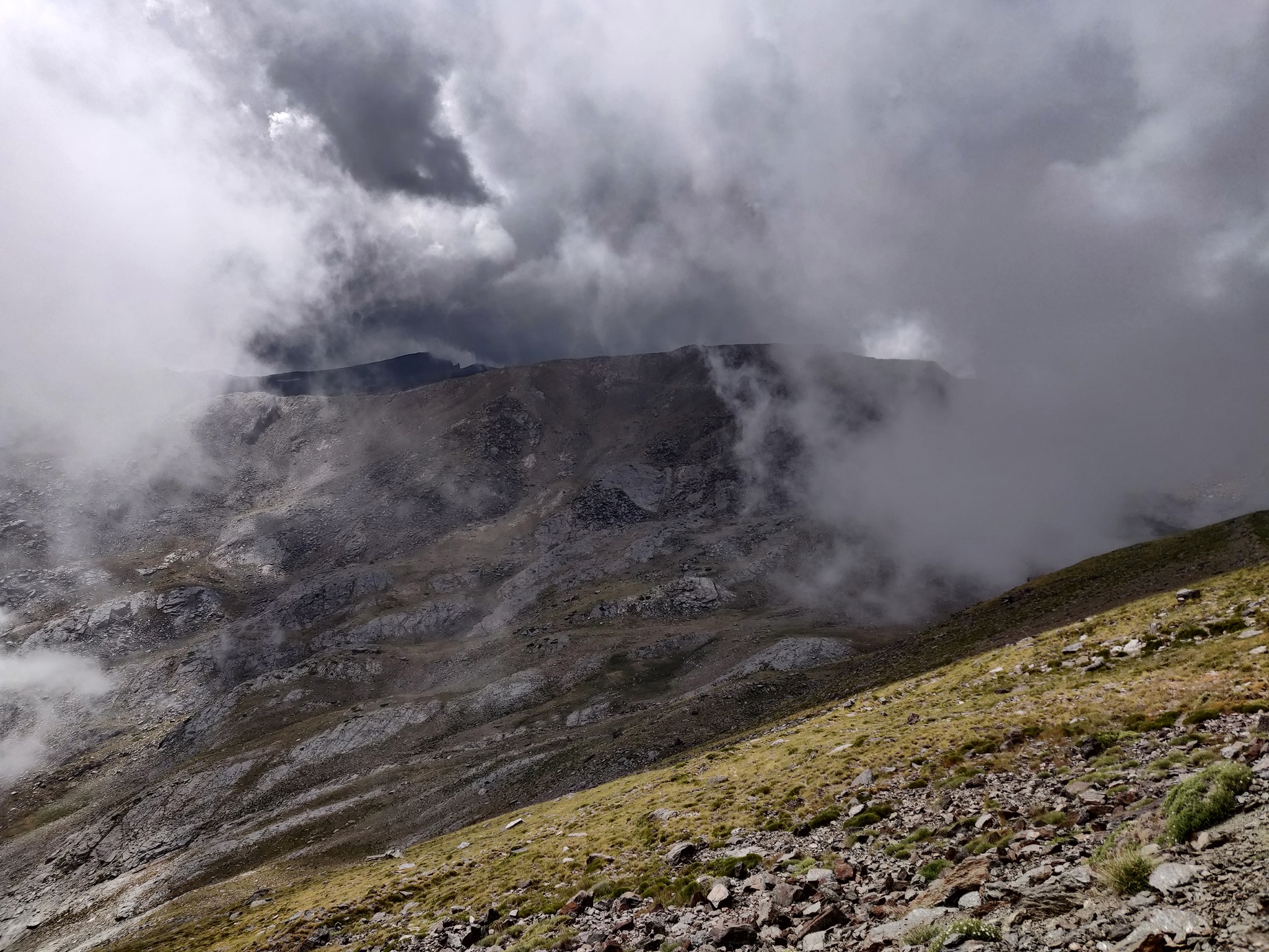 Veleta in the background came into view through a window in the clouds