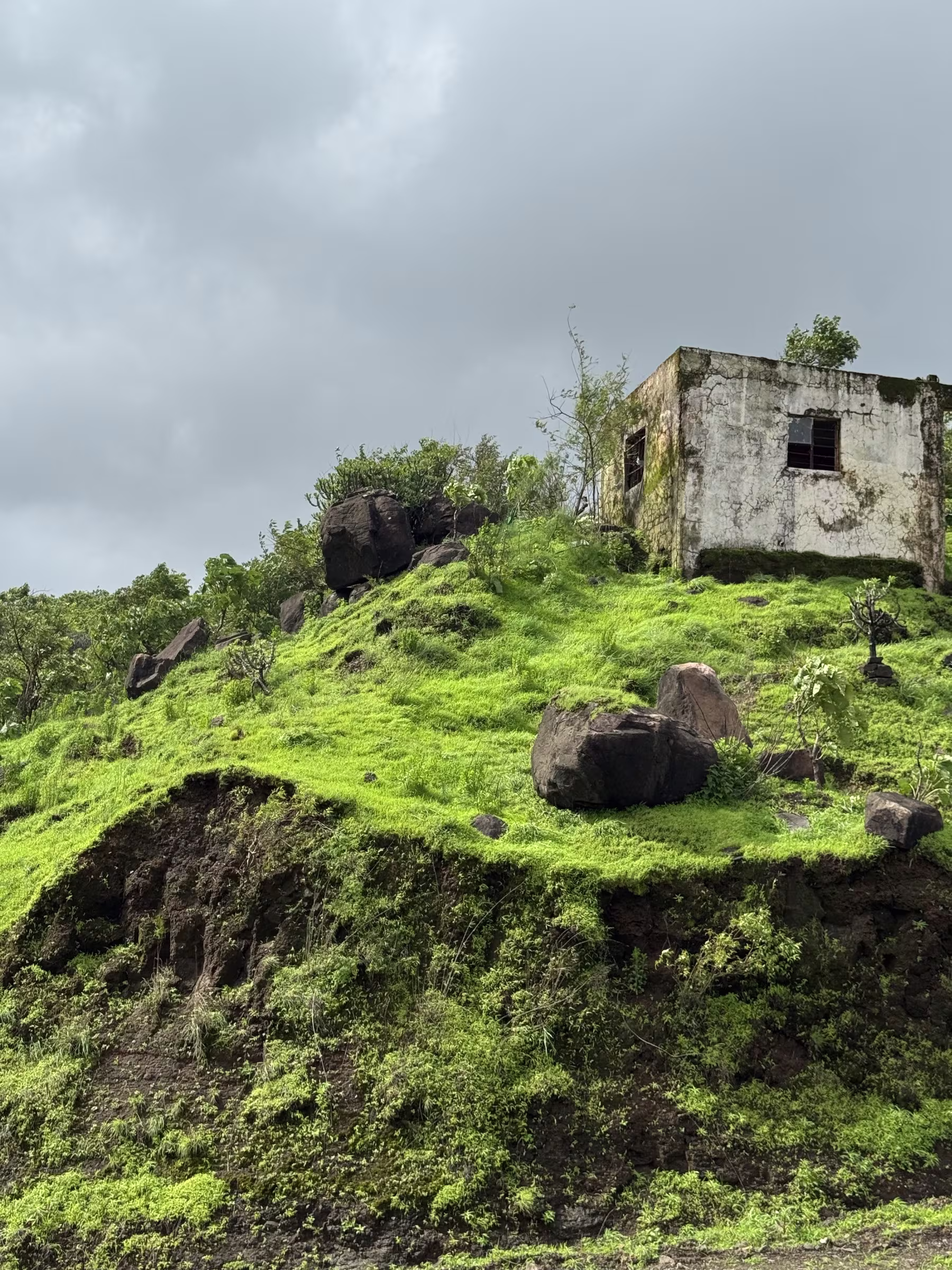 Historic stone structure and mountain textures along Pabe Ghat