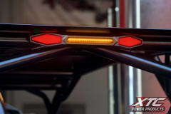 XTC X-Lite chase light bar on a UTV roll bar with red side lights and amber center light on