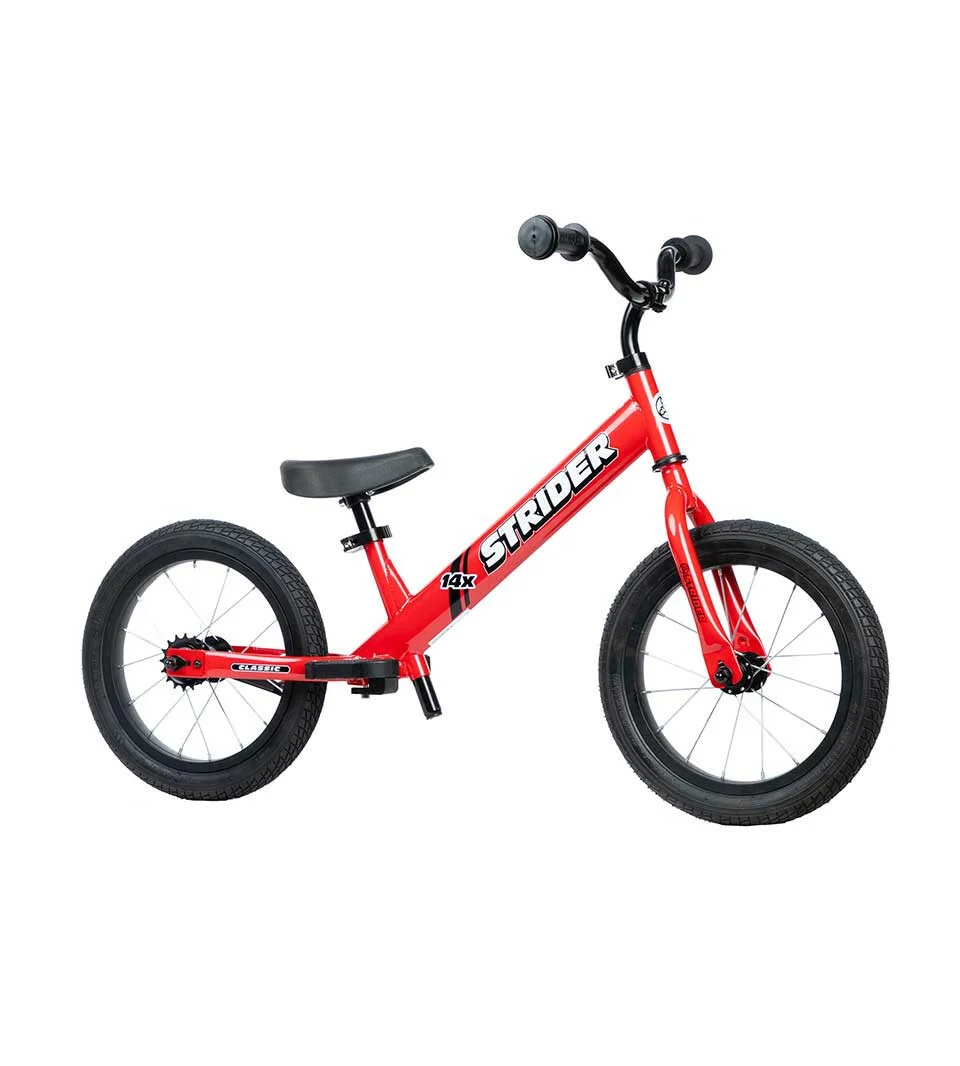Strider 14x balance bike in red, angled view without pedals