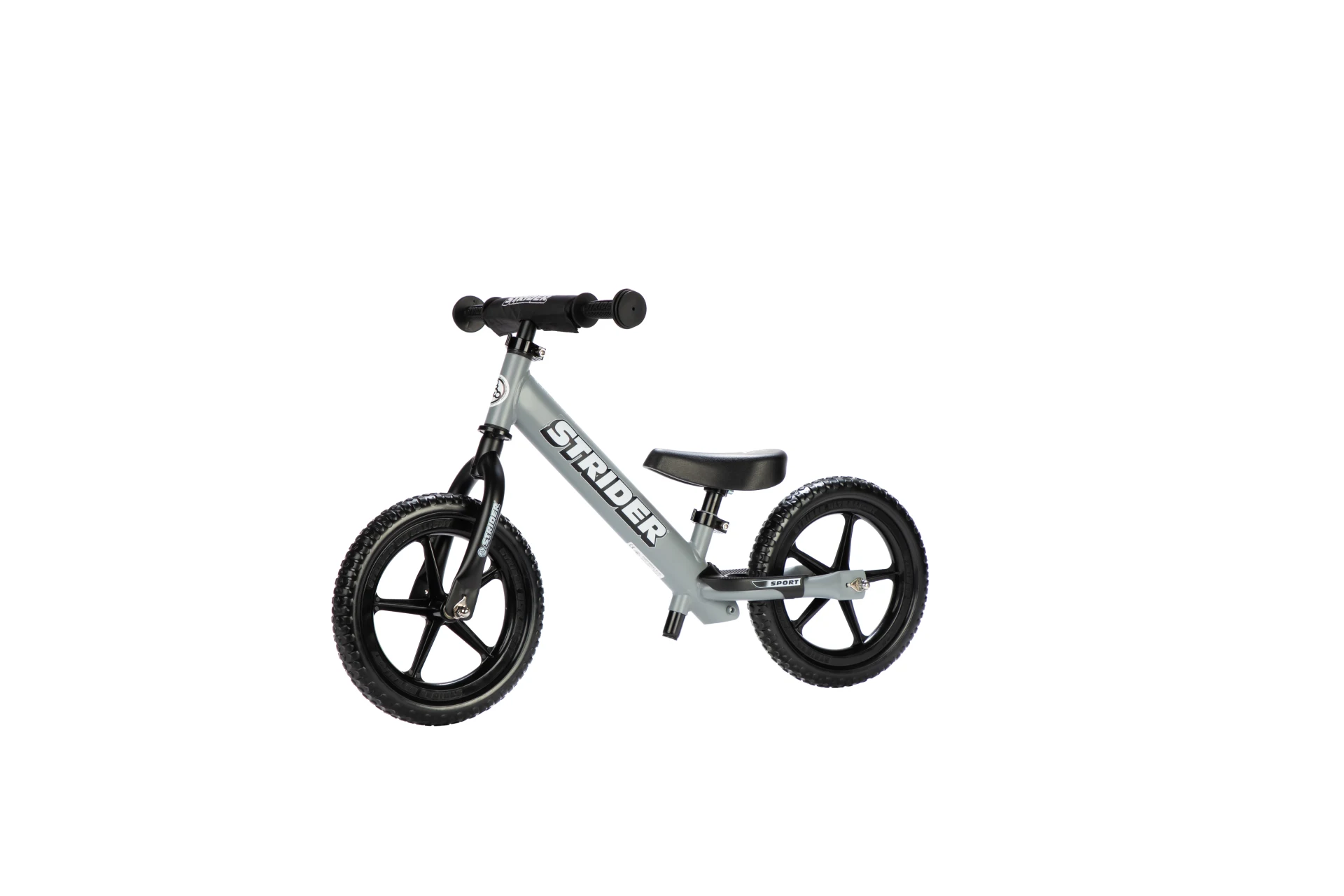 Strider 12 Sport balance bike in gray, front three-quarter view