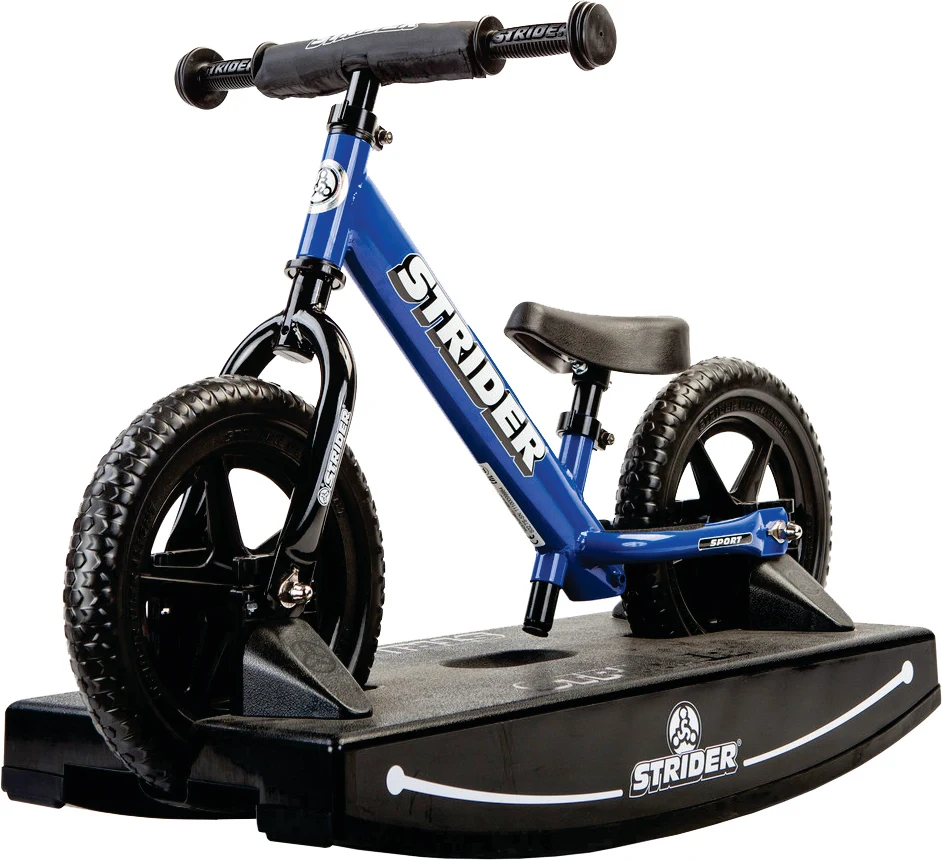 Blue Strider balance bike mounted on a black rocking base