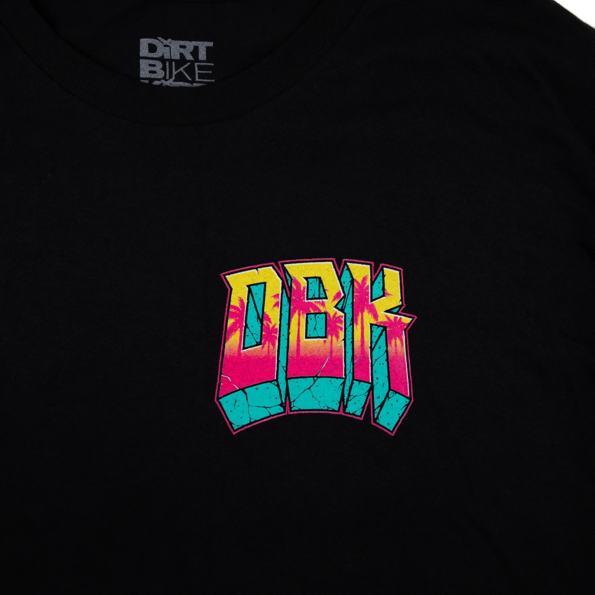 DBK Block X Block Tee in black, close-up of the front chest logo