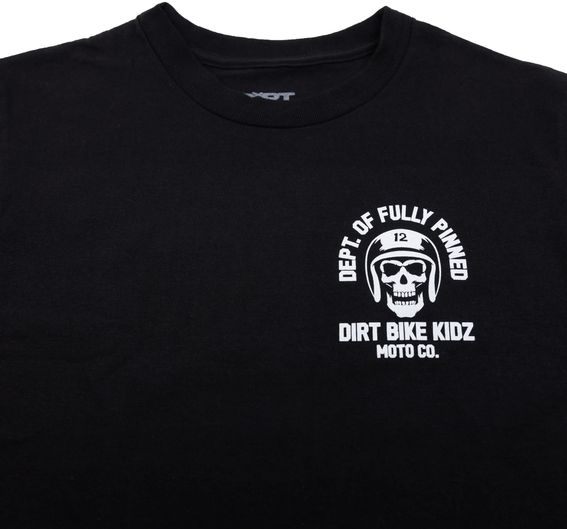 Close-up of the small white chest graphic on the black DBK Fully Pinned tee