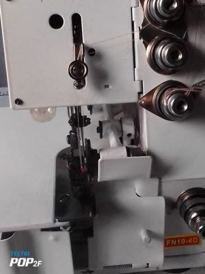 Four thread over lock domestic sewing machine