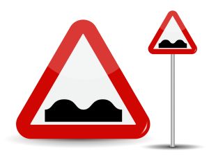 Warning traffic signs uneven road