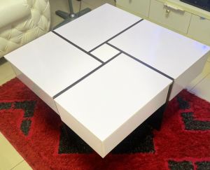 Sleek white center table with hidden storage