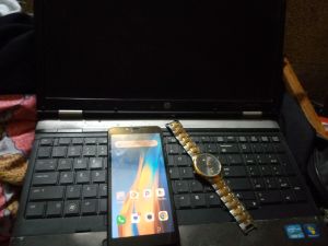 Phone, laptop and a watch