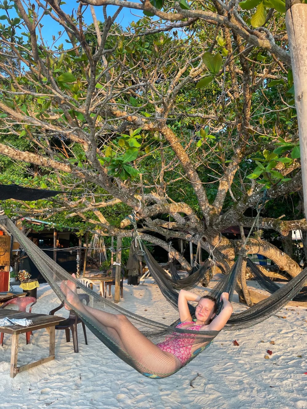 Laying on a hammock at Coral Beach on Pangkor Island in Malaysia