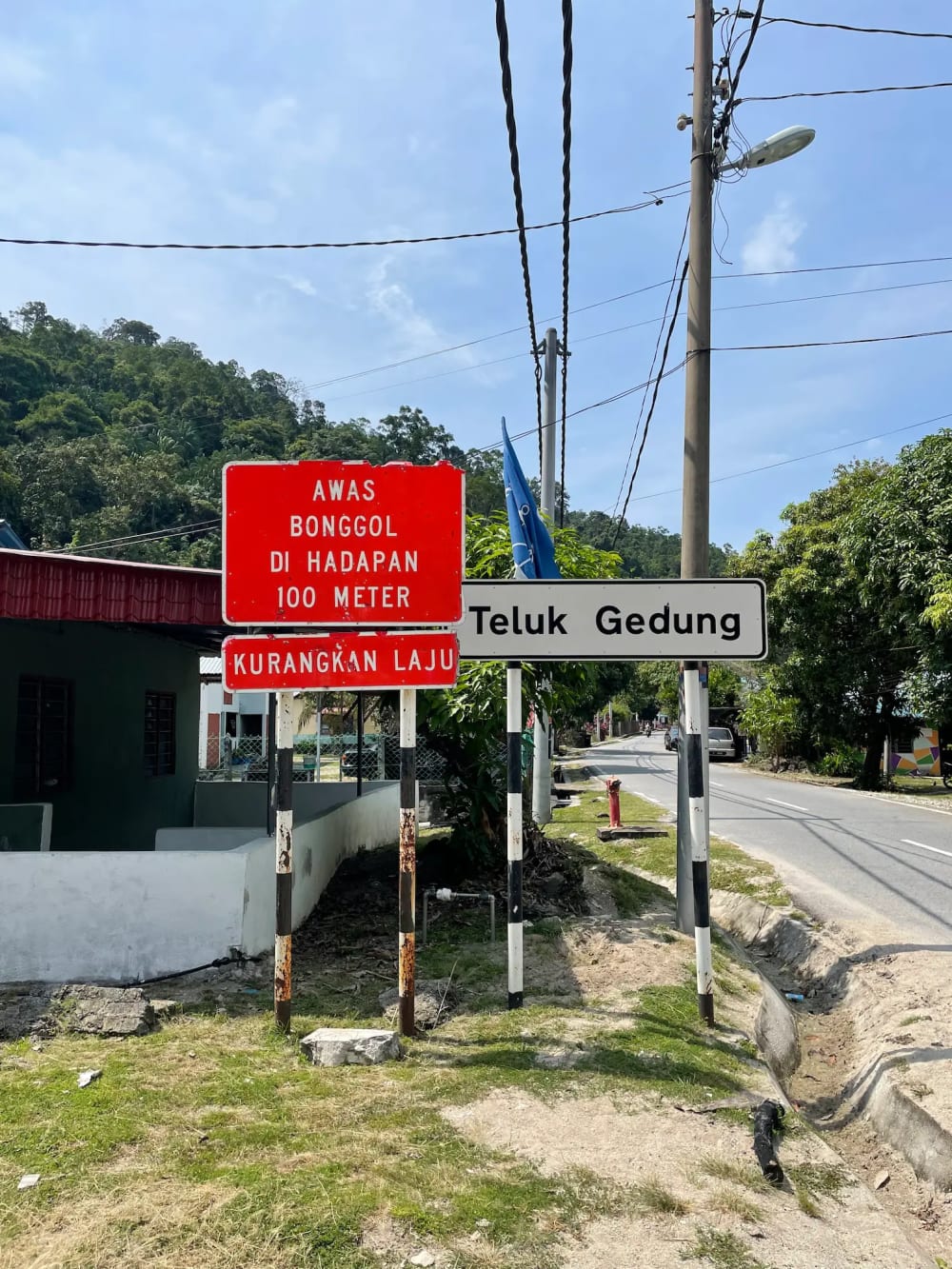 Street signs for Pantai Teluk Segadas hidden beach on Pangkor Island in Malaysia