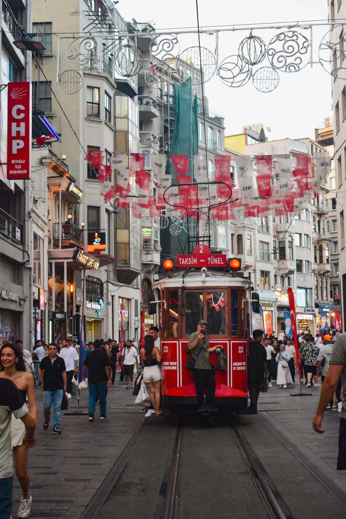 Taksim–Tünel Nostalgia Tramway iconic red tram on İstiklal Caddesi (İstiklal Avenue) famous pedestrian boulevard in Istanbul, Turkey