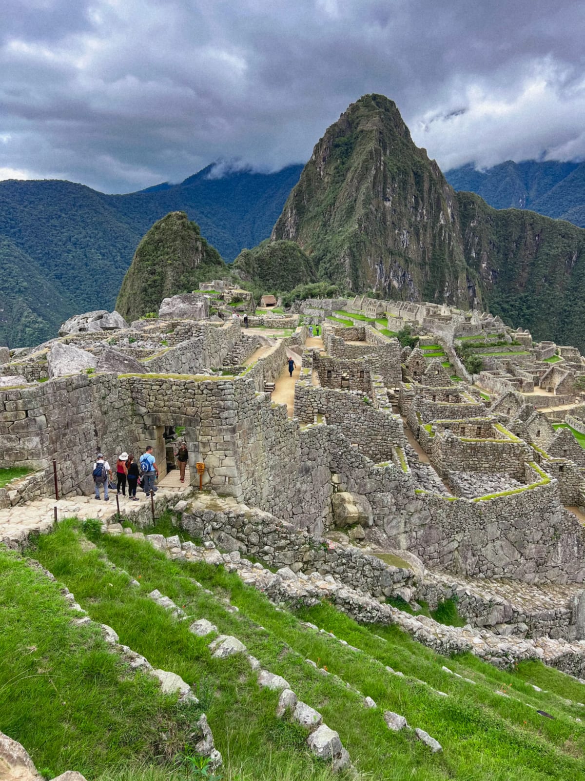 Machu Picchu sign in front of mountain in Aguas Calientes, Peru
