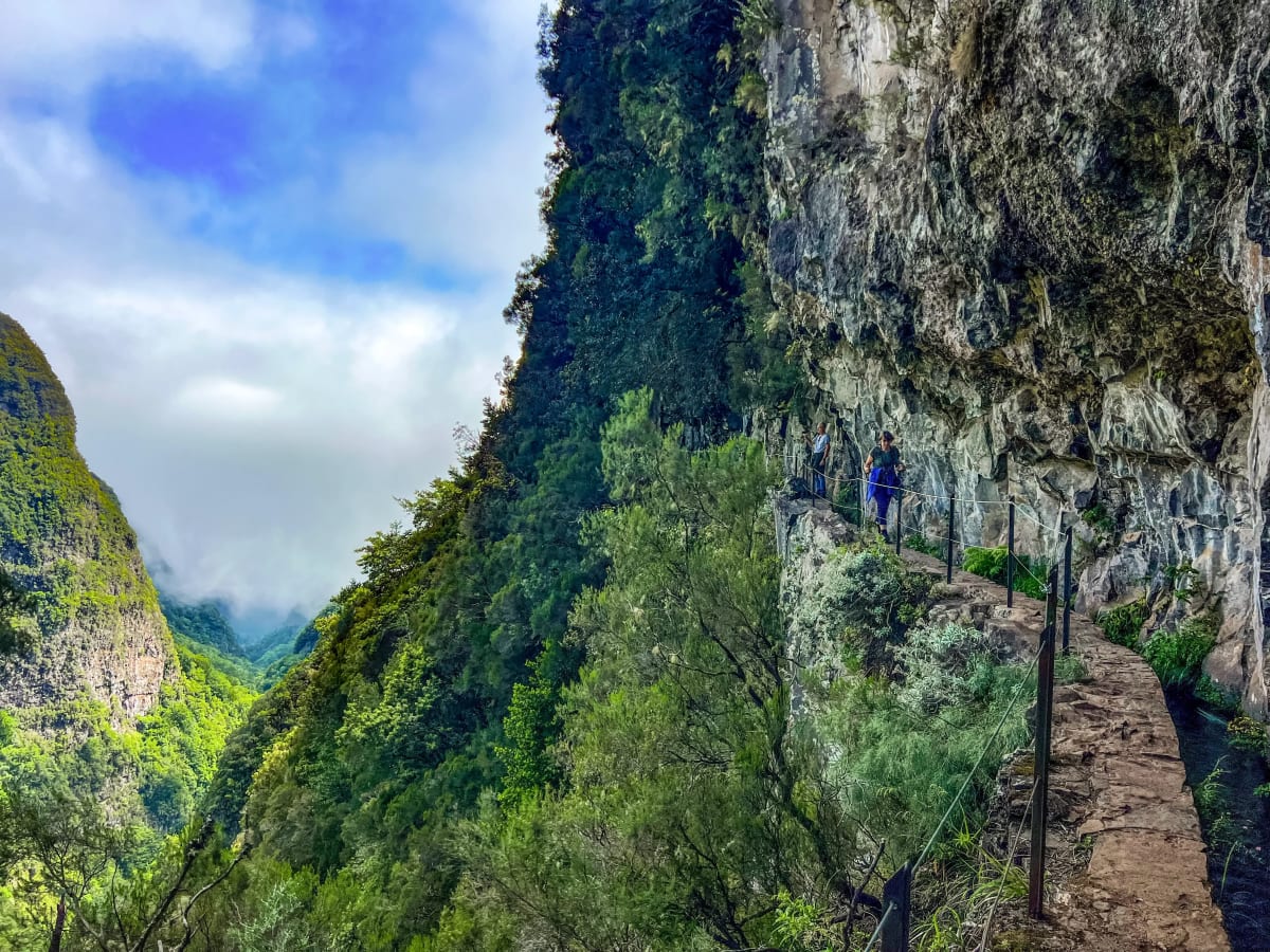 Trail on the edge of a mountain at Levada do Caldeirão Verde, PR9, on Madeira Island