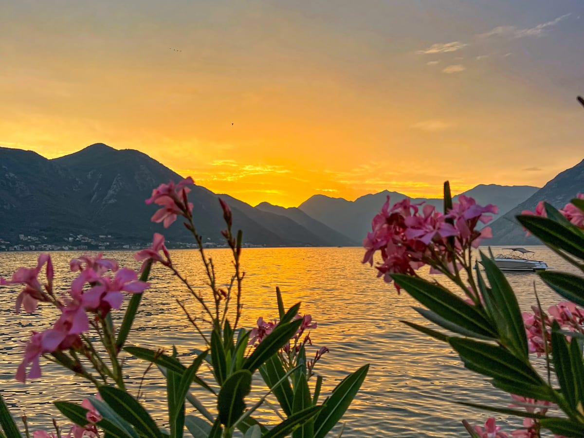 Beautiful orange sunset over the mountains of the Bay of Kotor in Montenegro