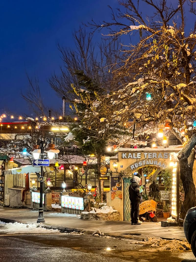 Göreme Cappadocia Turkey at night in the winter with Christmas decorations and snow