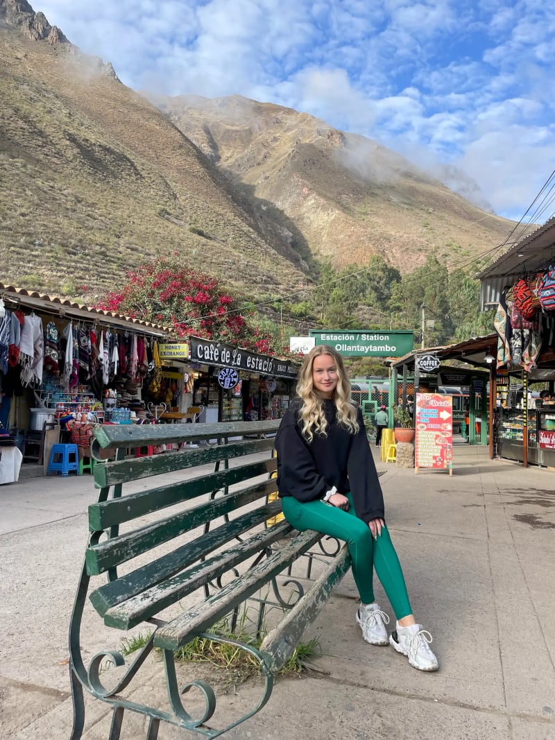 Girl at Ollantaytambo station in Peru going to Machu Picchu
