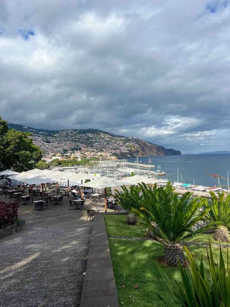 A restaurant overlooking mountains and the ocean at Parque de Santa Catarina in Funchal on Madeira Island