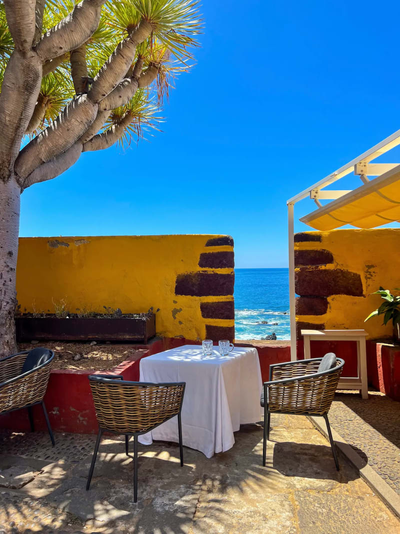 A small courtyard cafe inside Forte de São Tiago with Atlantic ocean views in Funchal on Madeira Island