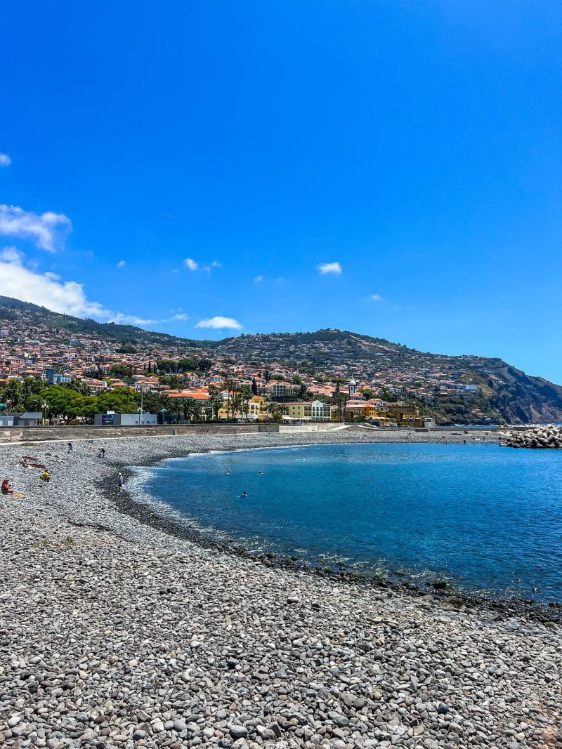 Praia do Almirante Reis beach in Funchal with mountain views
