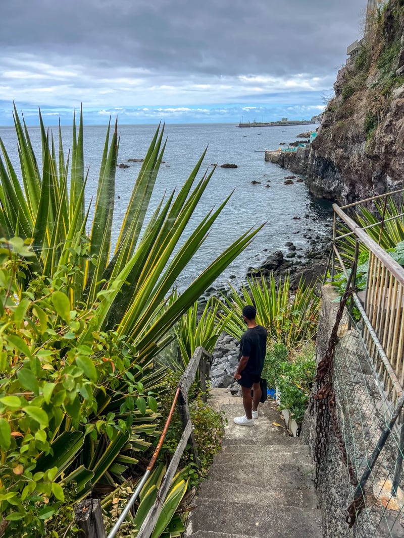 The path to Praia do Toco descending down stairs along a cliff in Funchal on Madeira Island