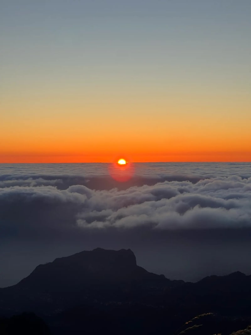 Sunrise over the clouds from Pico do Areeiro on Madeira Island
