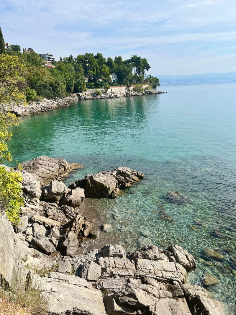 A small pebble beach along the coast of Opatija, Croatia